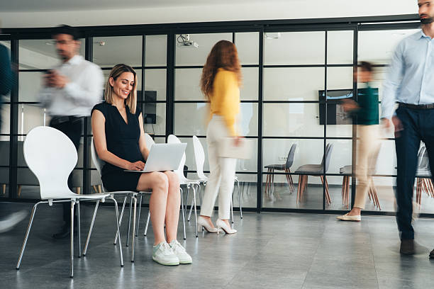 istock Focus in Motion - Busy modern workplace 2251350395