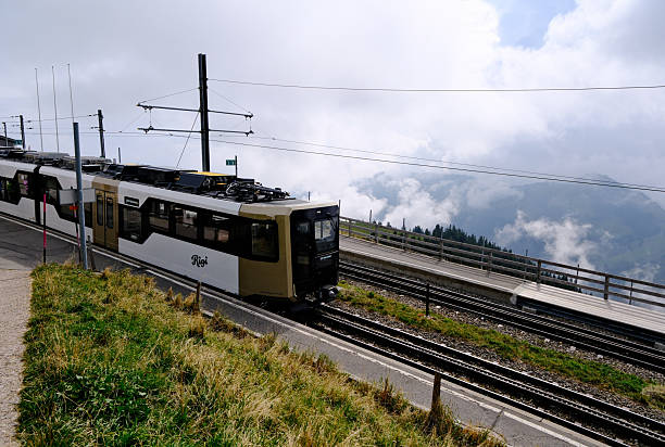 Rural scene of railway bridge through Lauterbrunnen valley and farm village at Bern, Switzerland