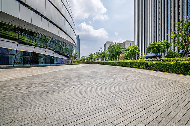 istock Empty square floor and modern architecture with city buildings background on a sunny day. 2251351275