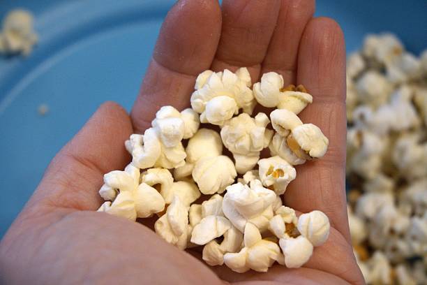 istock Popcorn on blue background, close-up, Copy Space 2251351779