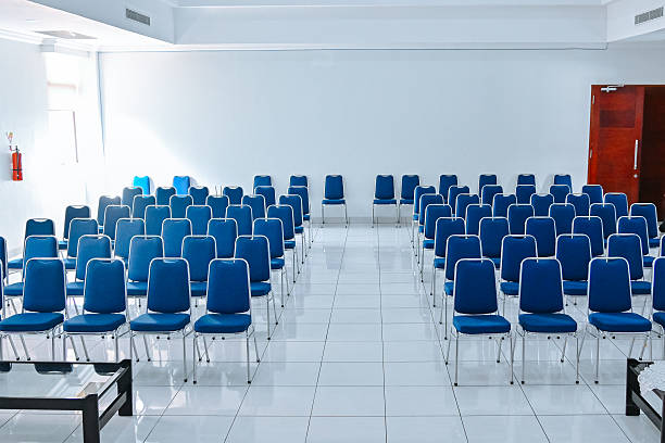 istock blue seminar chairs lined up neatly 2251351789