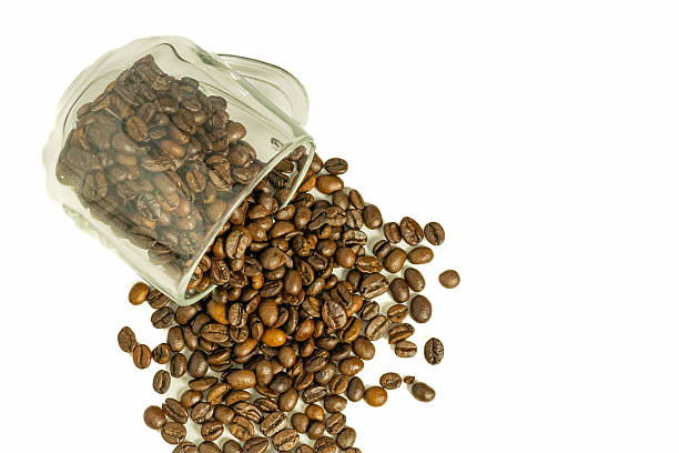 istock Coffee beans spilled from a cup on a white background 2251353986