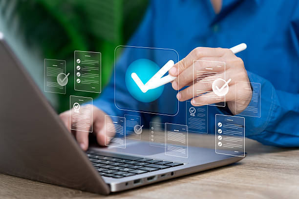 istock Quality Control, Digital Document Approval,  Businesswoman Reviewing, Checking, Signing Online Forms to Ensure Accurate Verification, Compliance, Standard Quality Assurance in Modern Business Workflow 2251355284