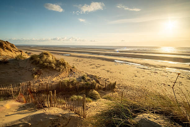istock Large beautiful empty sandy beach, dunes, sea and sun, Formby coast, England, UK 2251359270