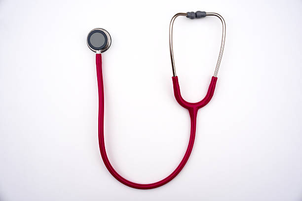 istock Top view of pink stethoscope against white background. 2251364708