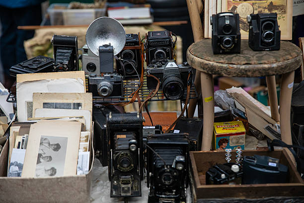 London, UK - November 20th 2025: Close-up of a table with vintage cameras and photography paraphernalia on it.