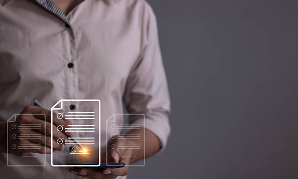 istock Young man with smartphone mobile hand using a pen touching to sign a Online Business Contract, Electronic signature, Contract signing, Digital documents, Future smart contract 2251367949