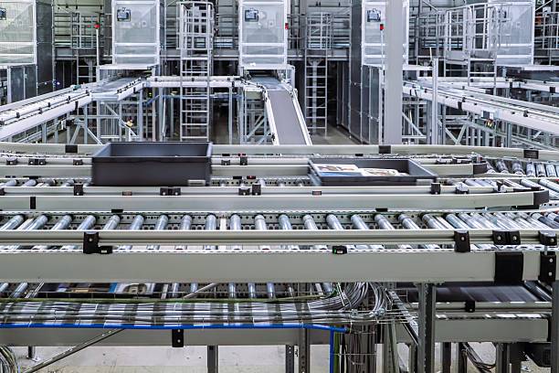 istock packing line in a logistics warehouse. conveyor belt in a modern production line 2251369324