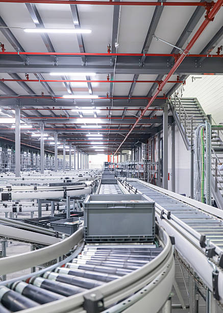 istock packing line in a logistics warehouse. conveyor belt in a modern production line 2251369328