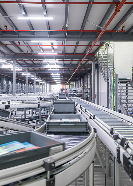 istock packing line in a logistics warehouse. conveyor belt in a modern production line 2251369329