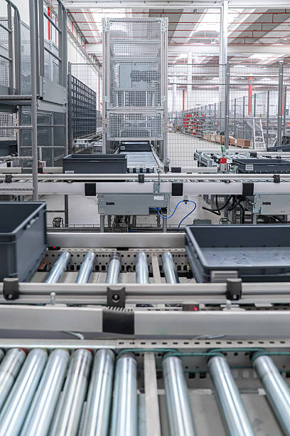 istock packing line in a logistics warehouse. conveyor belt in a modern production line 2251369334