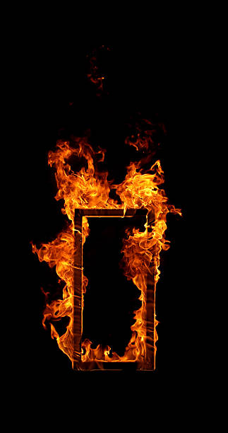istock Burning wooden frame isolated on a black background. 2251369835