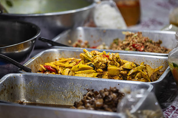 Different kind of Asian foods are selling on Asian street food market stall.Phuket Island - Thailand.