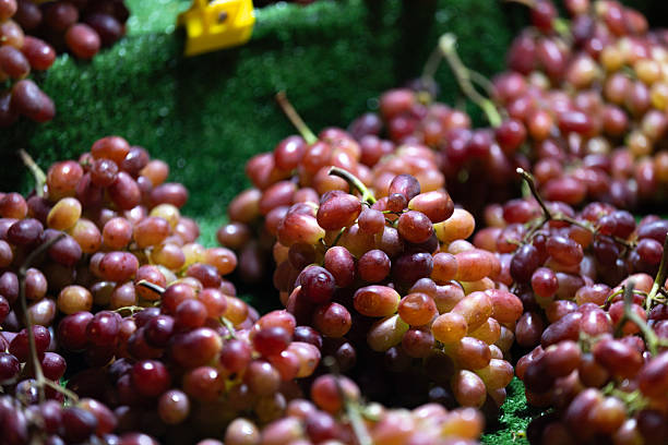 Close up of a bunch of red grapes.