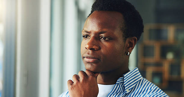 istock Creative, black man and thinking with vision in office for project strategy, improvement or insight. Businessman, employee or thoughtful designer with idea or solution for company agenda or tasks 2251373505