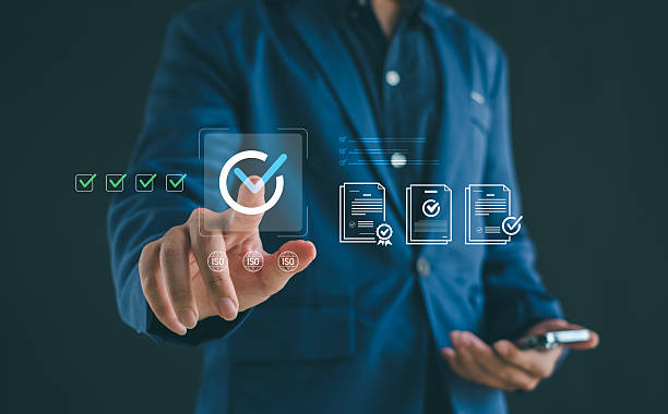 istock Quality assurance concept with business professional selecting digital certification and compliance icons, illustrating modern standards management, document approval, reliable workflow processes. 2251374813
