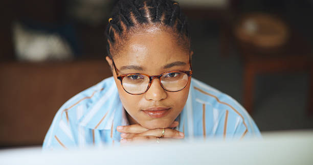 istock Business, thinking and black woman with tech, planning for creative project and decision. African person, contemplation or freelancer with pc, choice or confused with deadline for submission or ideas 2251375808