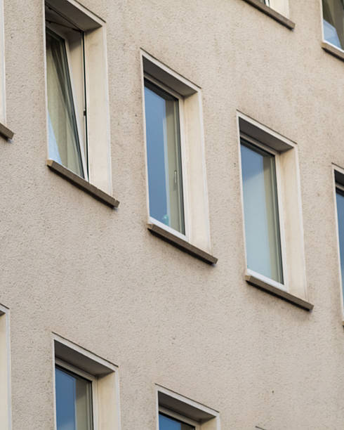 istock rows of windows on an older residential building 2251376476