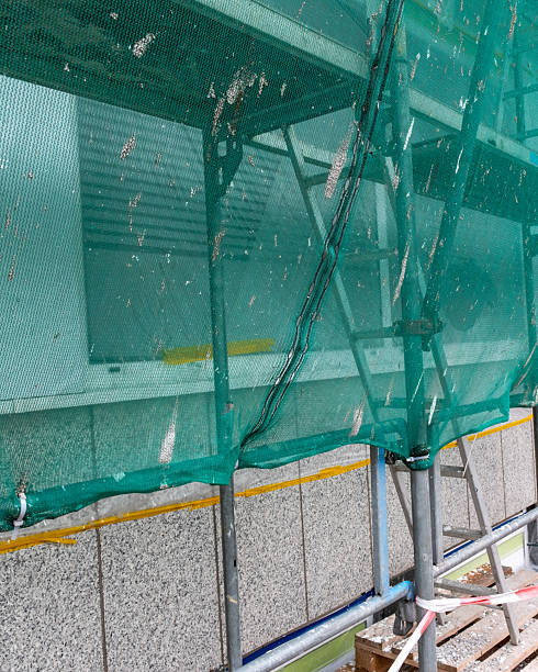 istock House construction site covered with a tarpaulin 2251376520