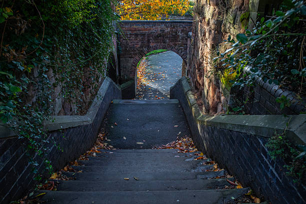 Steps down to the footpath along the River Severn in the city of Worcester in Worcestershire, UK.
