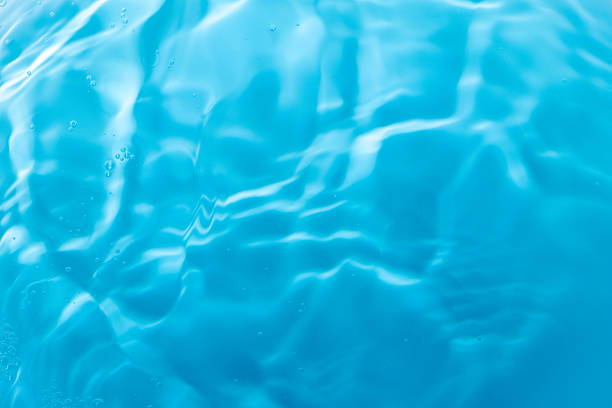 Vibrant water background with calm waves.