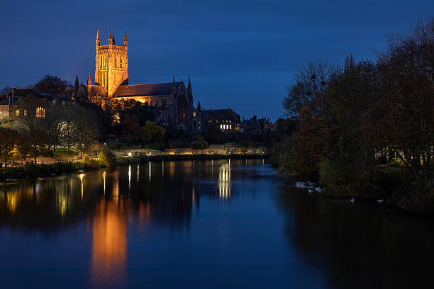 Dusk-time view over the River Severn in the city of Worcester, UK, looking towards the magnificent Worcester Cathedral.