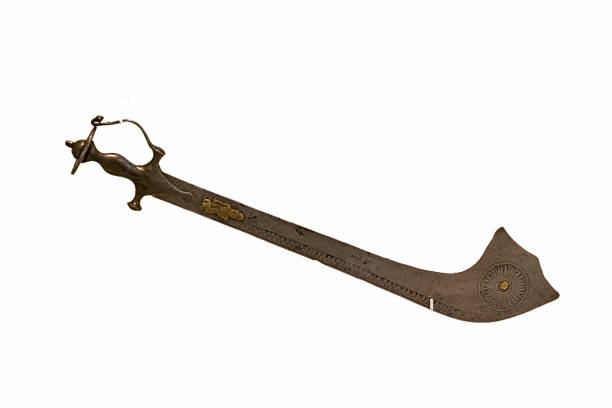Unique curved sword with intricate design from historical culture displayed on a plain background