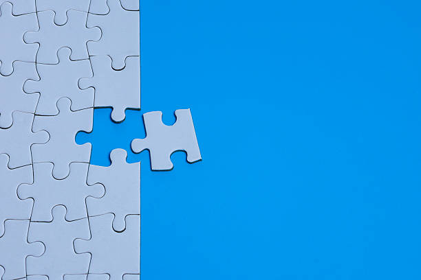 istock Corporate Merger and Acquisition Concept with White Puzzle Piece and Blue Copy Space 2251381539