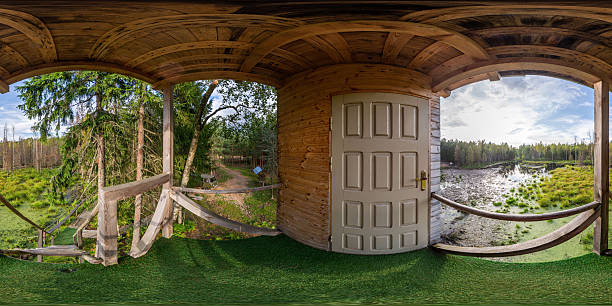 Full seamless 360 degree HDRI spherical panorama. Tower for hunters with video surveillance cameras for animals and windows for guns. Hunting tower in a swamp in a dense forest in sunny weather