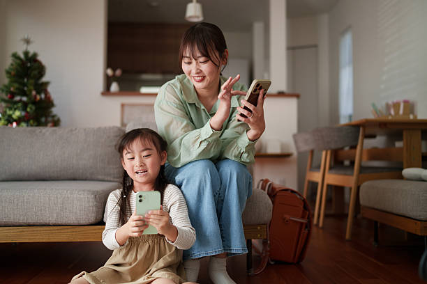 istock Child using mobile phone during leisure time at home 2251386773