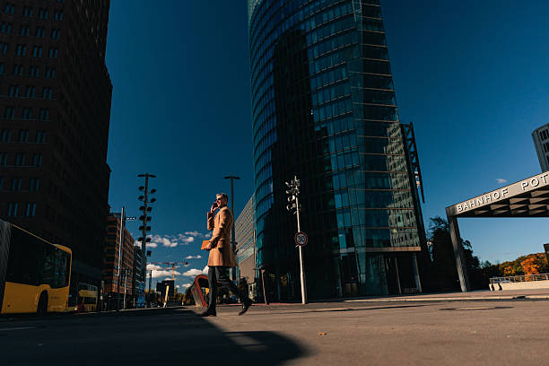 istock Stylish Man Walking at Potsdamer Platz in Berlin 2251387821