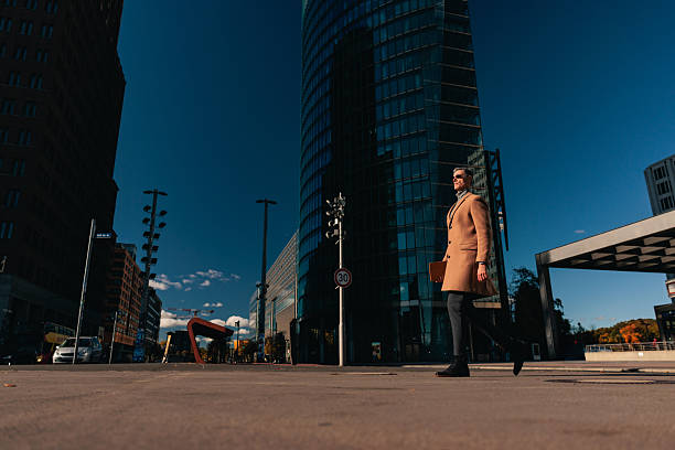 istock Stylish Man Walking at Potsdamer Platz in Berlin 2251387850