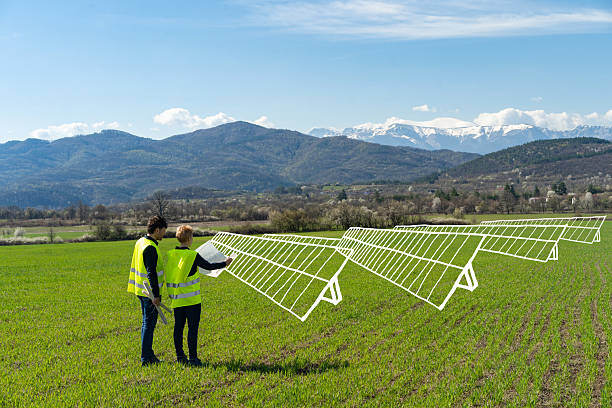 istock A line drawing of solar panels while two engineers look at plans in a remote location 2251392018