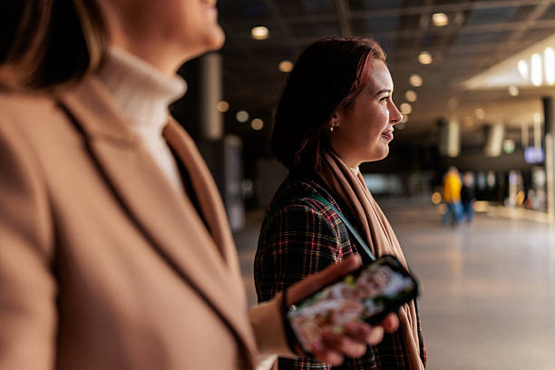 istock Two Women Walking Indoors in a Modern Building 2251392136