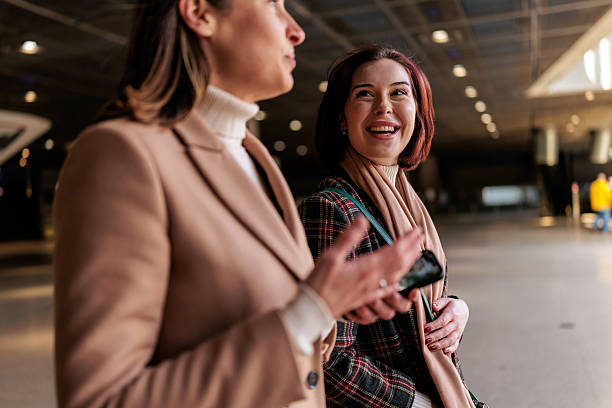 istock Smiling Professional Woman Enjoying a Friendly Conversation Indoors 2251392167
