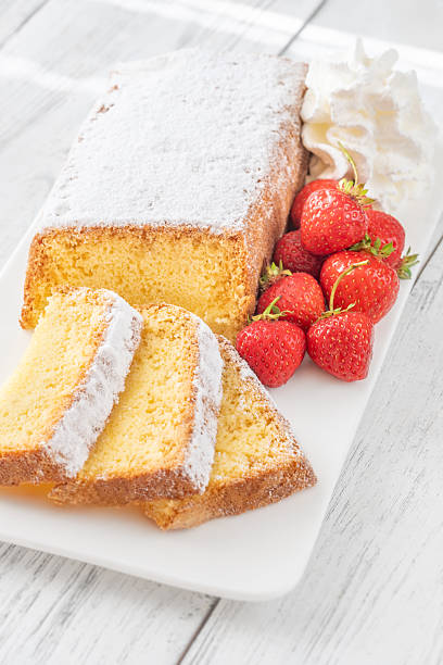 istock Pound Cake Slices with Whipped Cream and Strawberries on Elegant White Plate 2251392574