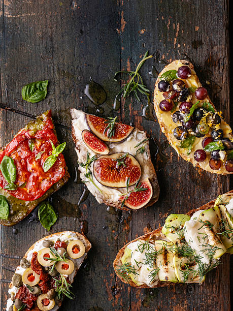 istock Assorted Bruschetta and Tapas on Rustic Dark Wood Background 2251393526