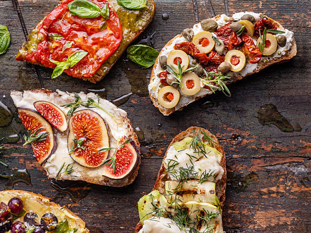 istock Assorted Bruschetta and Tapas on Rustic Dark Wood Background 2251394062