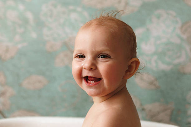 A beautiful, happy baby girl having a bath. Shot with a Canon 5D Mark IV.