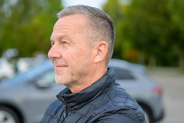 istock Mature Man Looking Into Distance 2251399059