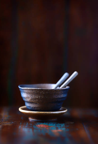 Traditional japanese ceramic on rustic wooden background. Soft focus. Copy space.
