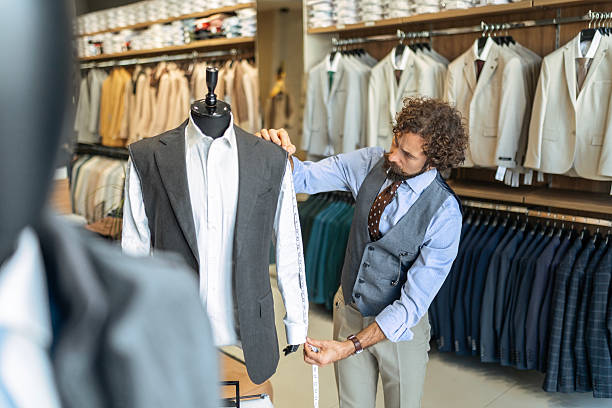 istock Professional Fashion Designer Working on Custom Jacket in His Design Clothing studio 2251400200