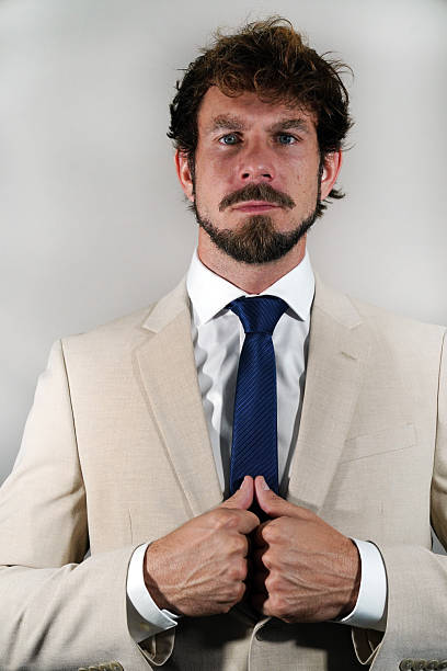 Male posing for sports Football, Basketball and beach volley ball. Casual werr and business attire. Business suits and headshots.