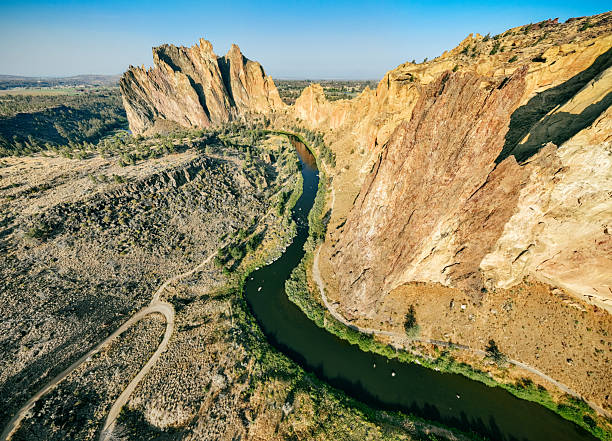 Morning views of the beautiful rock formations at Smith Rock State Park in Oregon state.   The Crooked River winds through the middle of the looming geological features.  View from above.