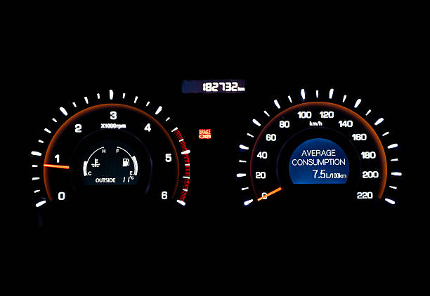 Close-up of a car speedometer with illuminated indicators on a dark background. Tordesillas, Valladolid, Castile and León, Spain, Europe - December 11, 2025.