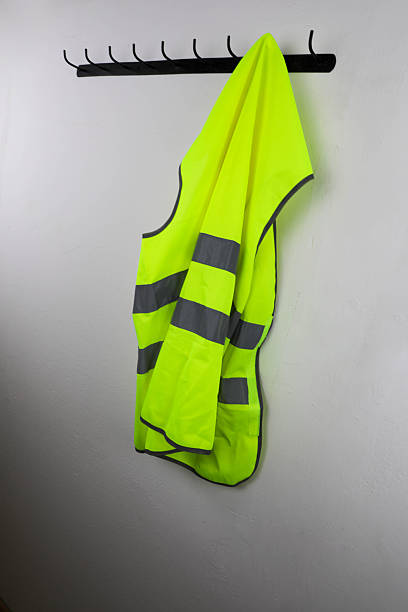 istock Safety Vest Hanging on Wall Rack 2251404863