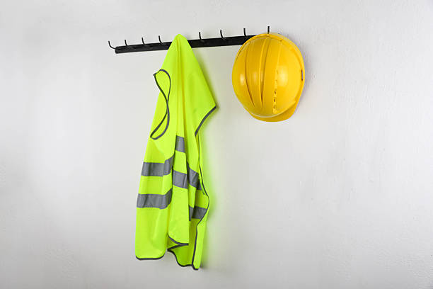 istock Yellow Safety Gear Hanging On Wall 2251405068