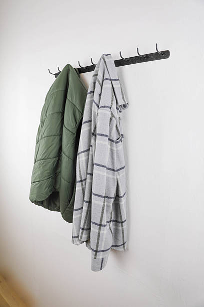 istock Hanging Outerwear on Metal Hooks 2251405089