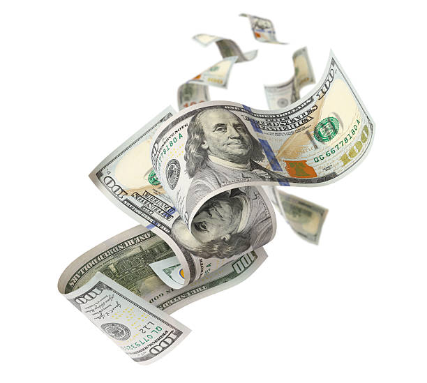 istock Flying hundred dollar bills, isolated on white background 2251411126