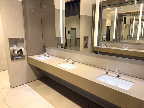 istock Clean, Modern Public Bathroom Sinks and Mirror in Minimalist Style 2251412130